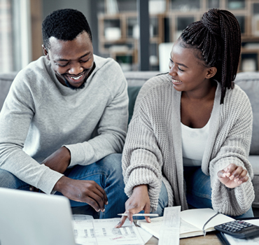 A man and woman look at insurance