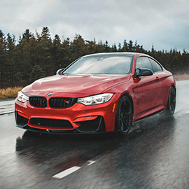 Image of car driving on rainy roads