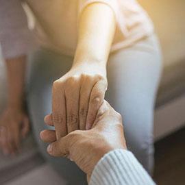 Image of couple holding hands